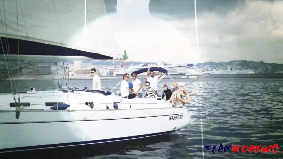 A crew working together on board during a sailing regatta