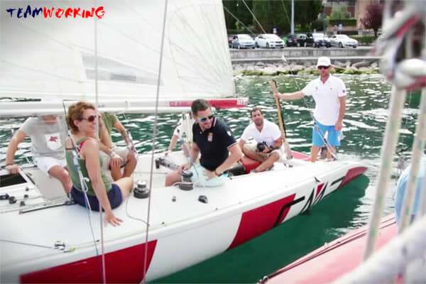 A crew working together on board during a sailing regatta