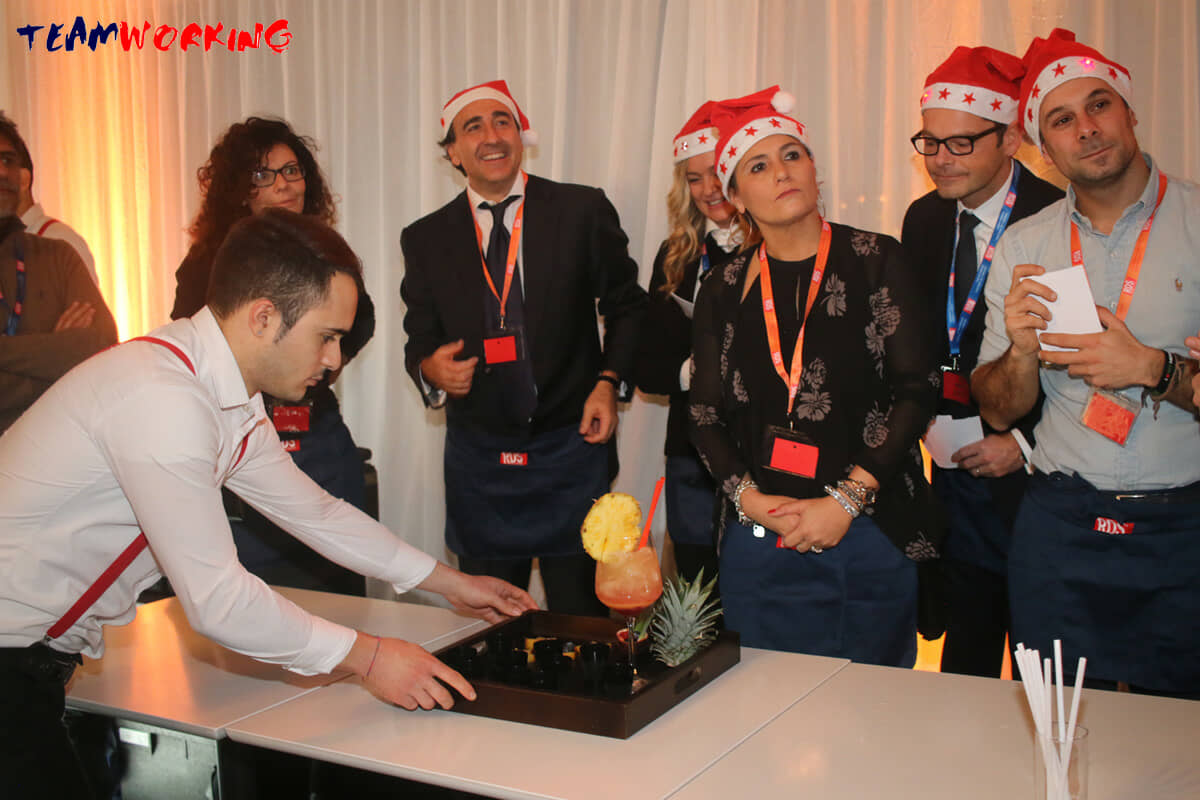 A team mixing cocktails with professional bartenders