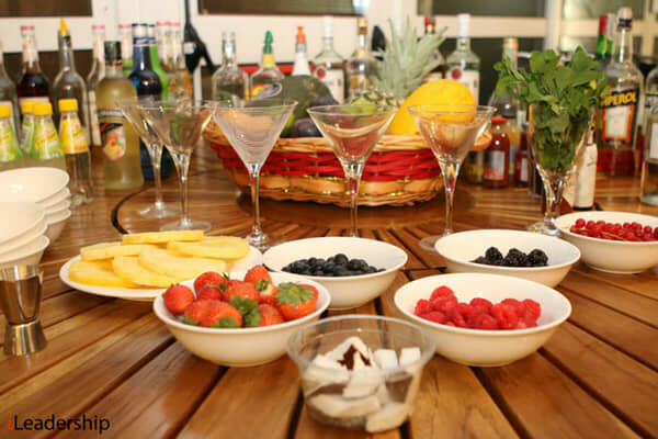 A team mixing cocktails with professional bartenders