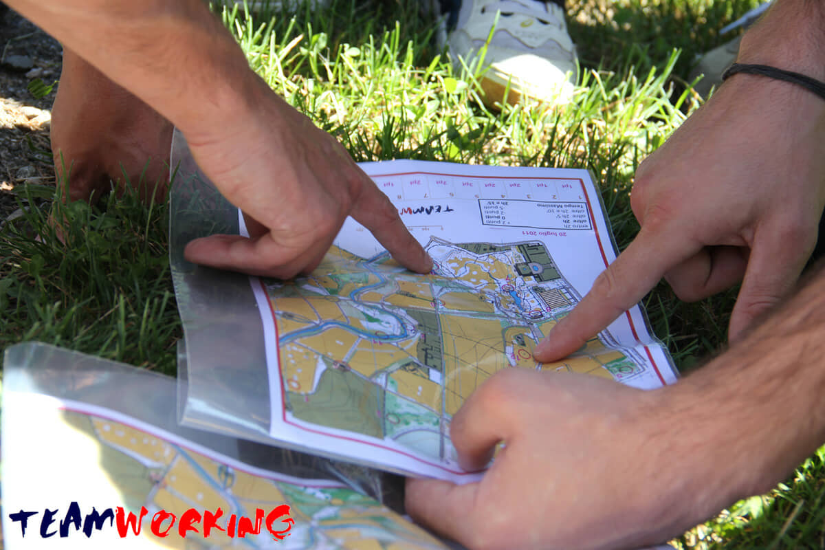 A team working through an outdoor exercise in the open air