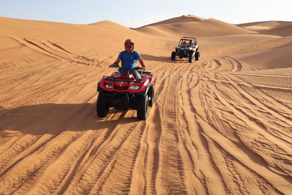 A team finding its way with a map and a compass among the dunes