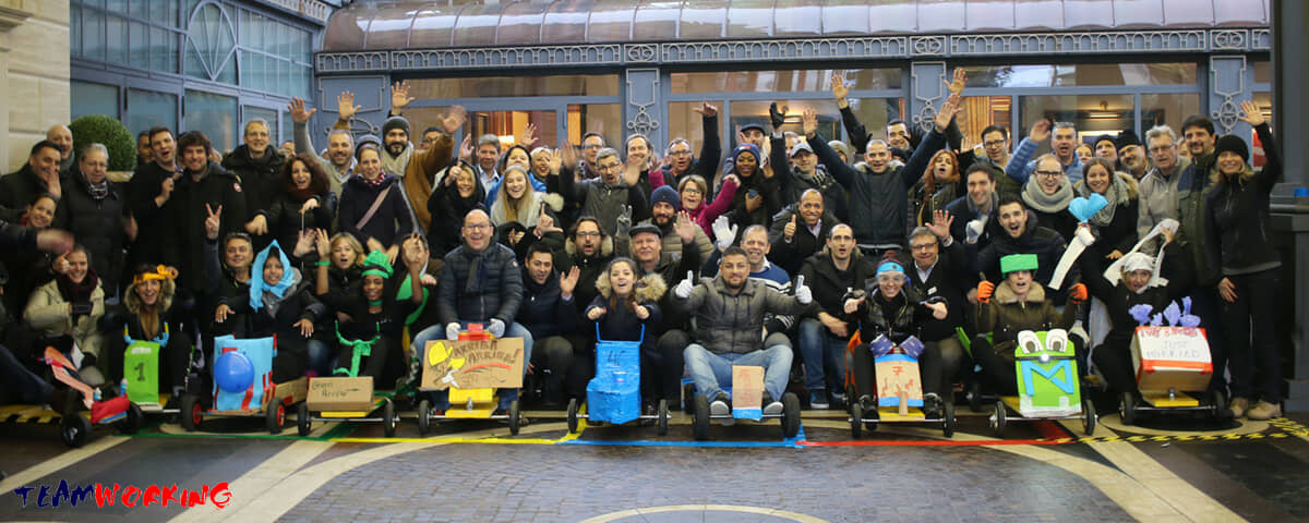 A team with the soapbox cars they built, at the end of a Crazy Car Race