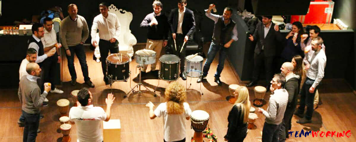 A room playing percussion together in a circle