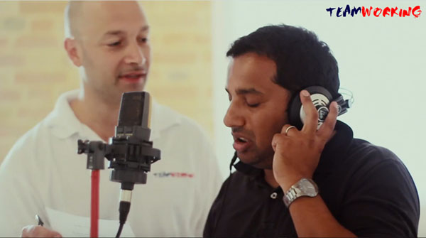 A team writing and recording a company song